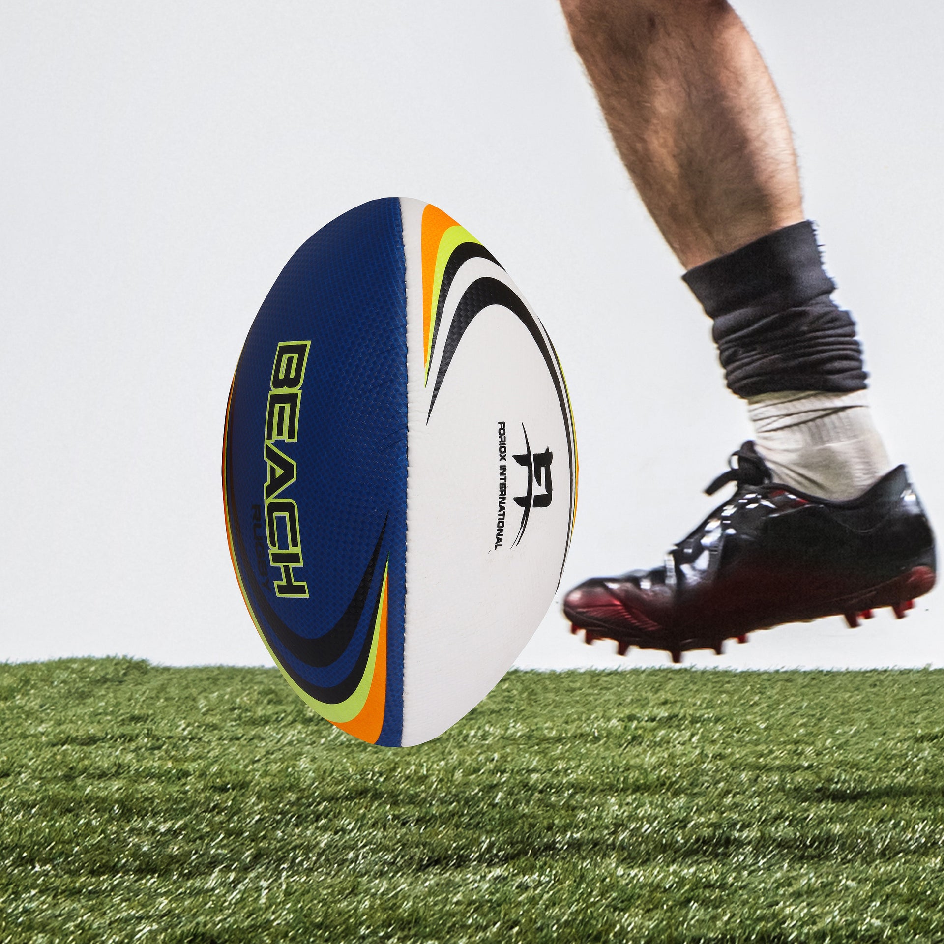 Oval-shaped rugby ball with textured surface, ready for a game on the field.