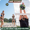 A close-up of a volleyball on a sandy beach, with the sun shining brightly in the background.